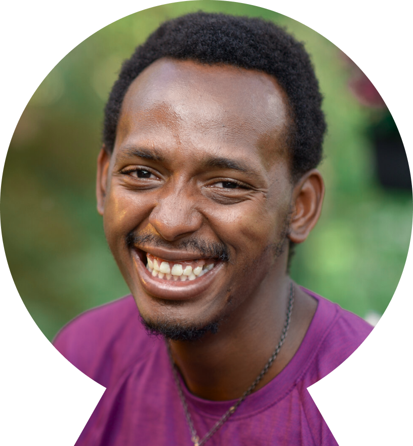 Smiling young African American man in a purple shirt Smiling young African American man in a purple shirt