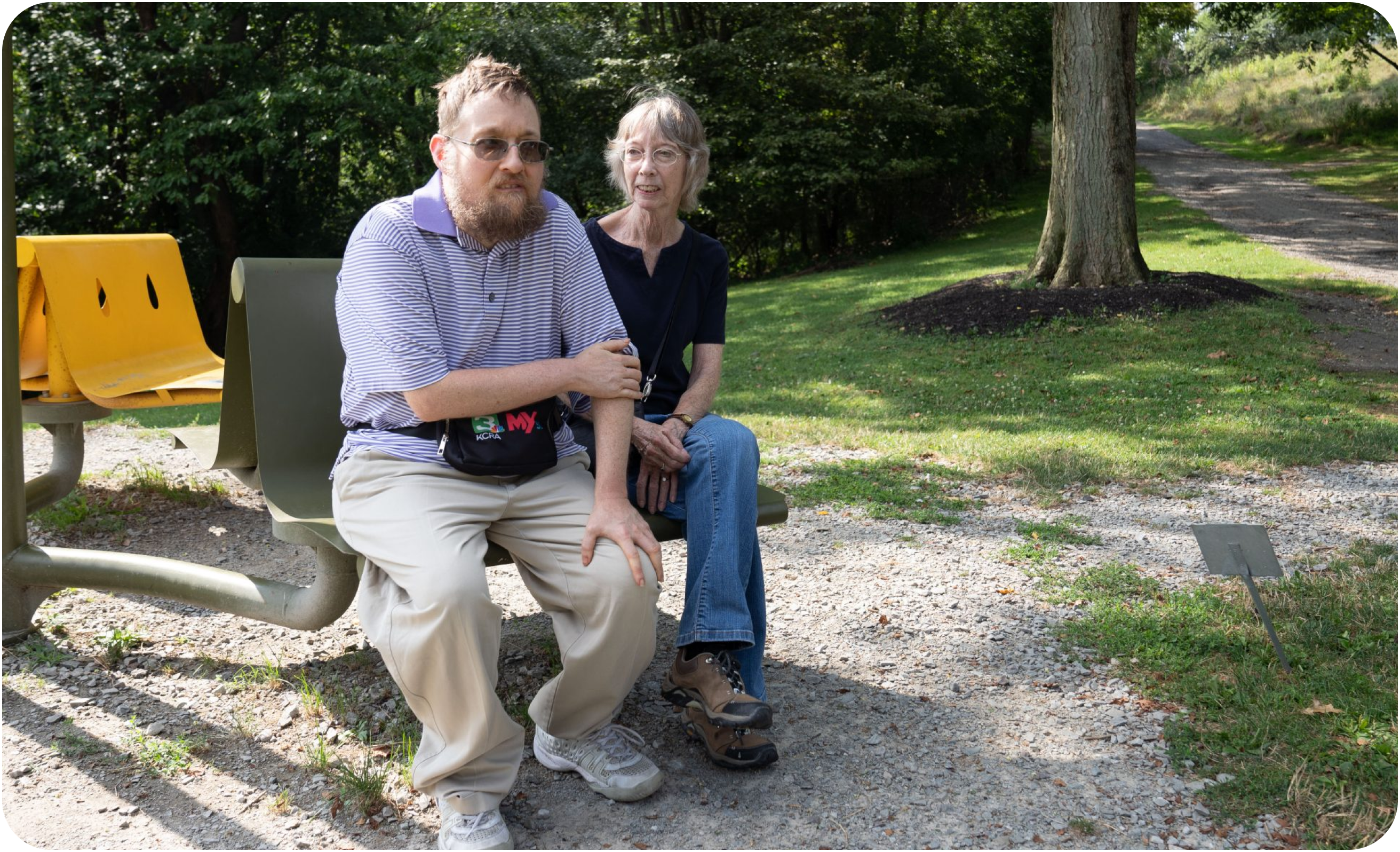 Elderly man and woman sitting on a park bench. Elderly man and woman sitting on a park bench.